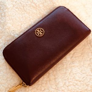 Tory Burch wallet burgundy color& gold hardware.